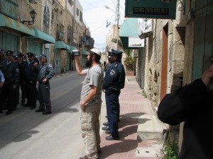 Watching him watching us: A Hebron settler films Shovrim Shtikah visitors to the city